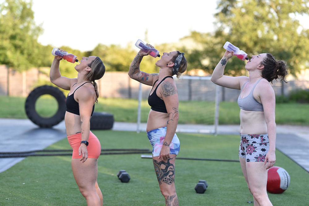 3 Women rehydrating after a workout with Ultima Replenisher