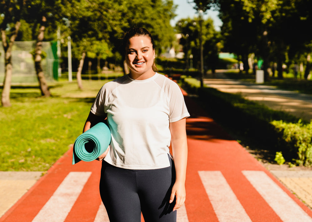 Woman with diabetes exercising outside and staying hydrated with Ultima Replenisher