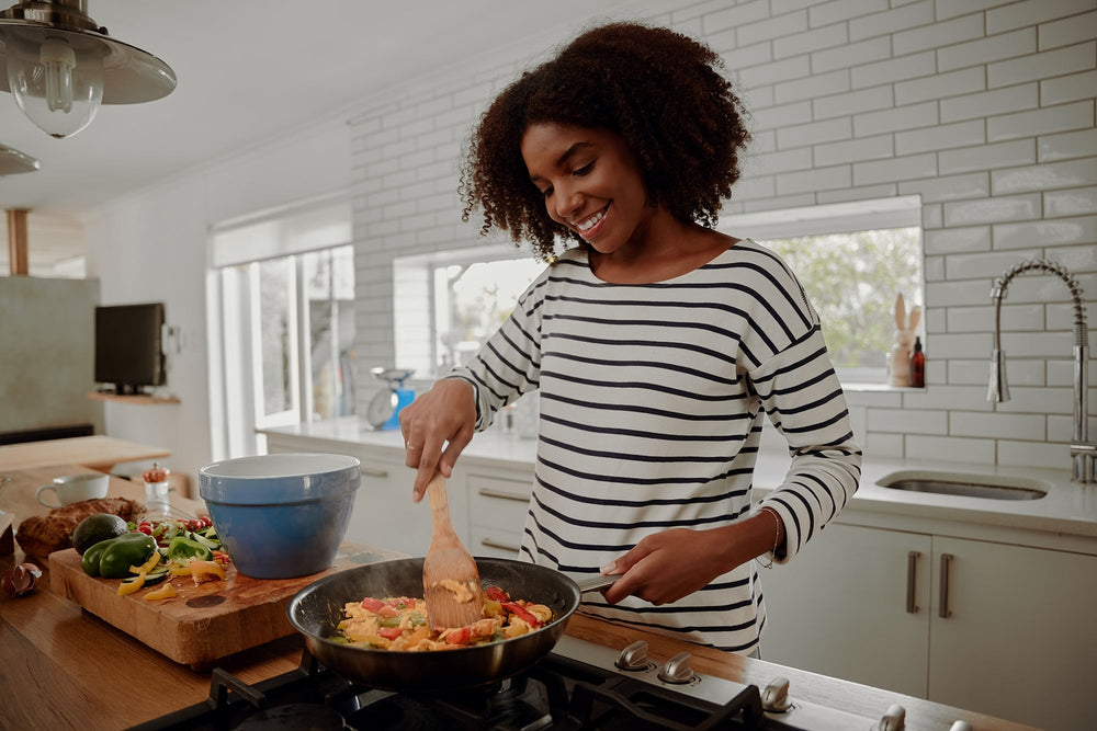 woman cooking potassium-rich food for keto diet