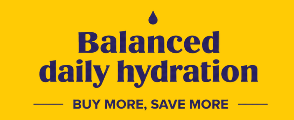 Promotional banner for Ultimate Herbal Tea products on a bright yellow background. The ad features two tea containers: Grape flavor in a purple jar and Lemonade flavor in a yellow jar, with a plus sign between them.