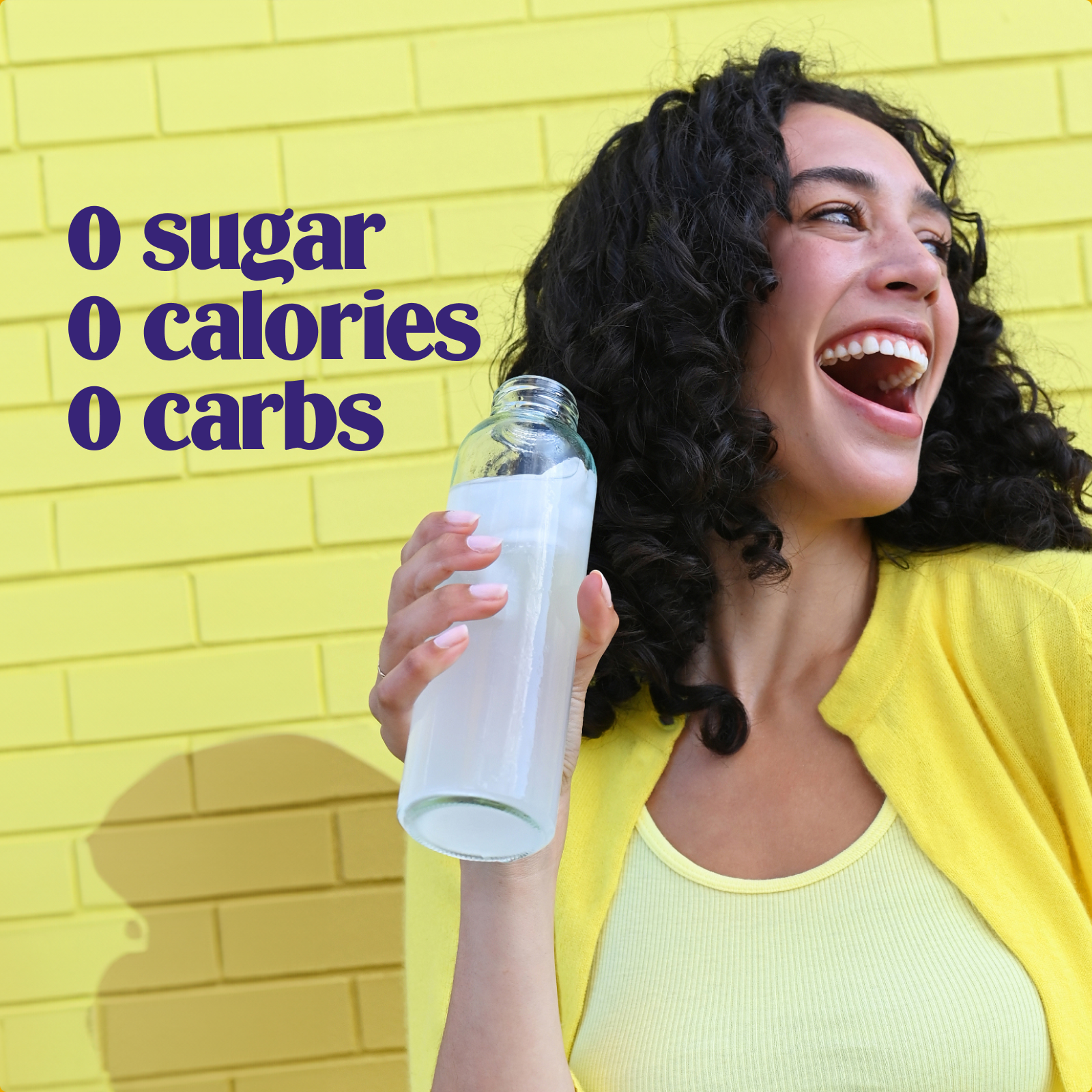 Ultima Replenisher Lemonade electrolyte hydration powder lifestyle woman with bottle 000