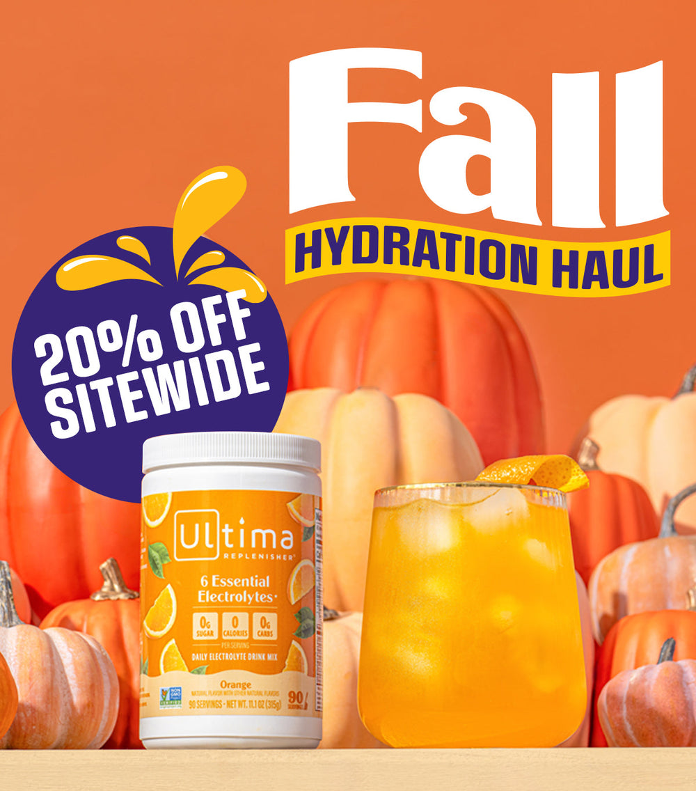Ultima Nutrition Fall Hydration Haul promotional graphic featuring a tub of orange electrolyte drink mix and an orange iced drink in front of pumpkins on an orange background, with a blue '20% OFF SITEWIDE' badge and large 'Fall HYDRATION HAUL' text.