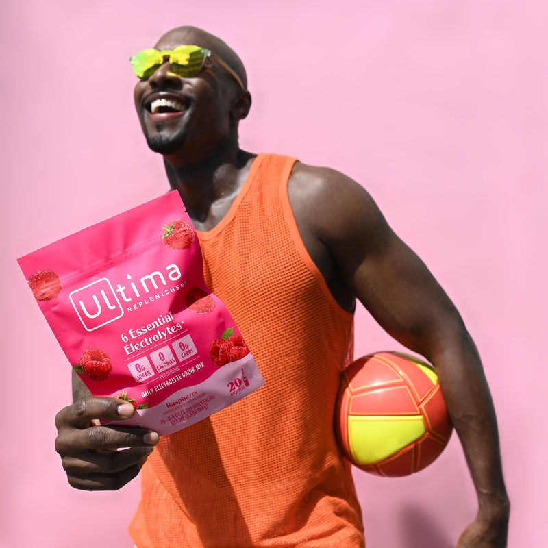 Ultima Raspberry pouch with model and volley ball