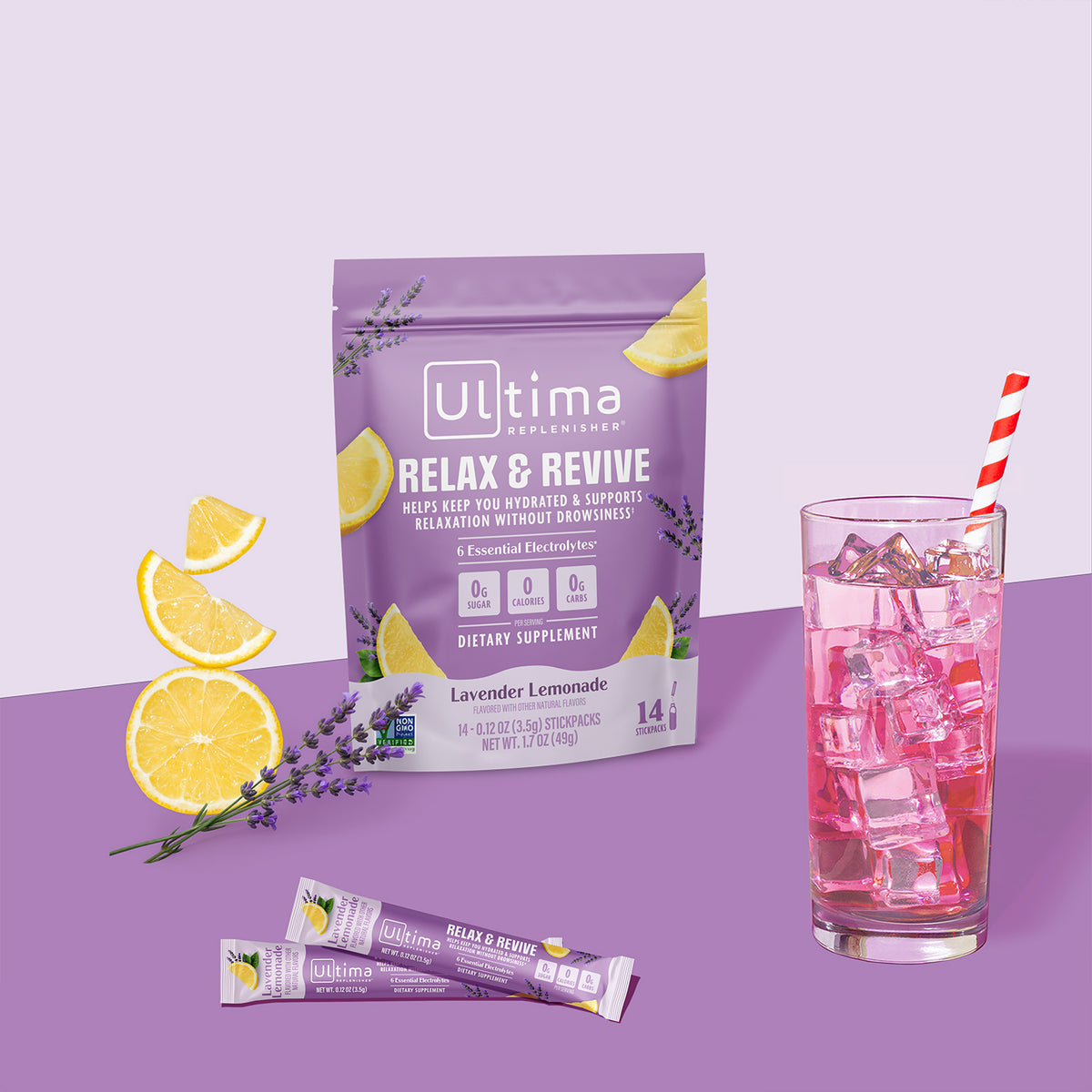 Ultima Replenishment Relax & Revive dietary supplement pouch in lavender lemonade flavor, shown with two single-serve sticks and a glass of pink iced drink with a red-and-white striped straw on a lavender background.