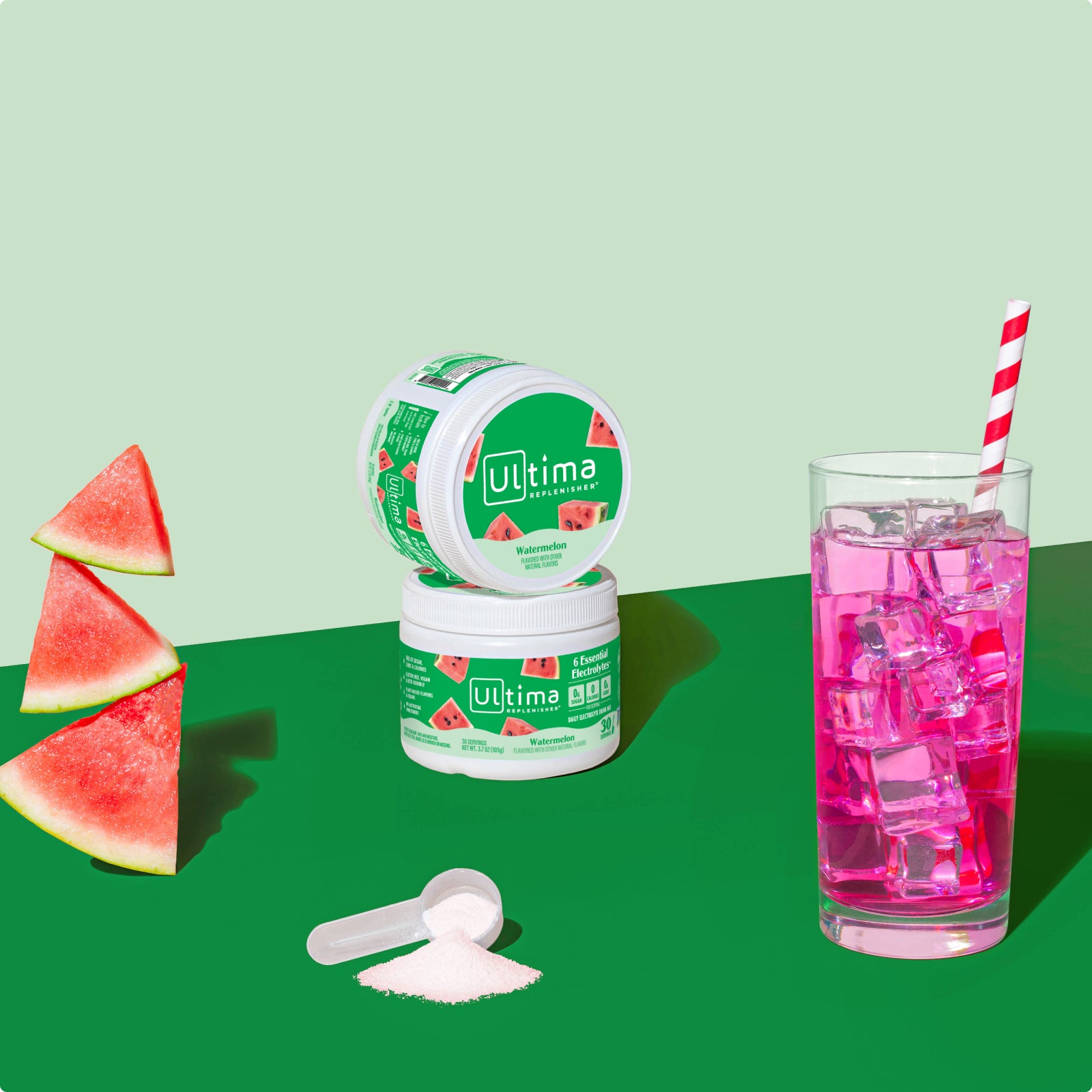 Ultima Replenisher Watermelon electrolyte hydration powder 30 serving canister lifestyle with glass and fruit