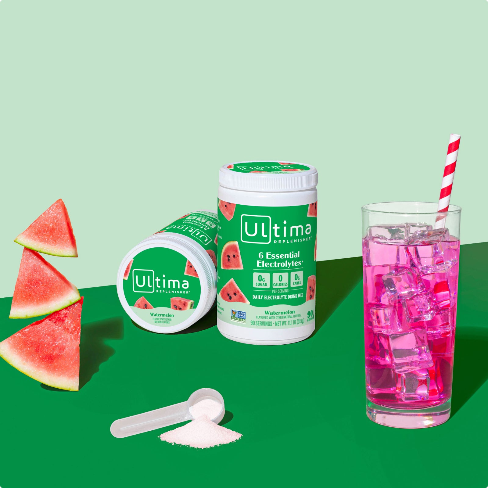 Ultima Replenisher Watermelon electrolyte hydration powder 90 serving canister lifestyle with glass and fruit
