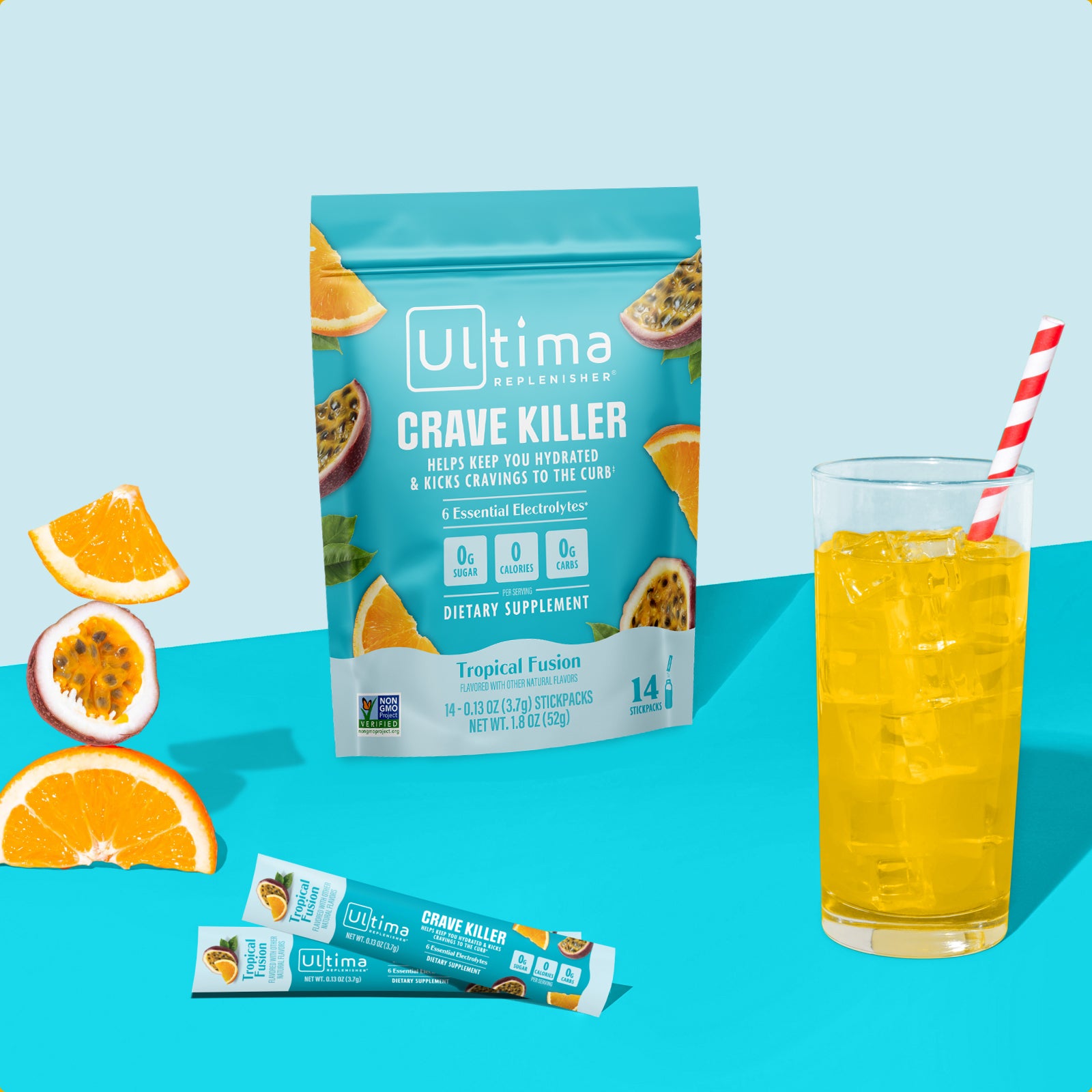 Ultima Replenisher Crave Killer electrolyte hydration powder pouch lifestyle with glass and fruit